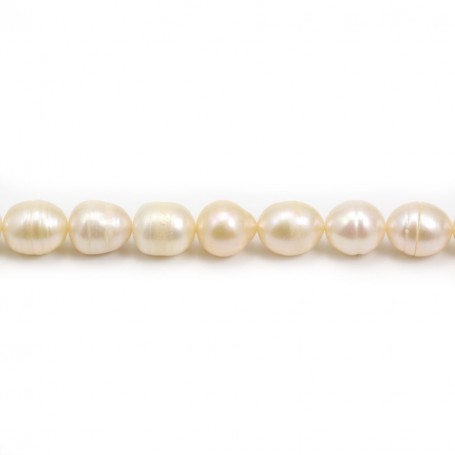 Salmon color oval freshwater pearls on thread 10x12mm x 40cm
