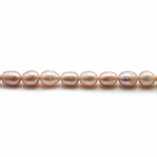 Perles d'eau douce ovales rosé sur fil 6-7mm x 40cm
