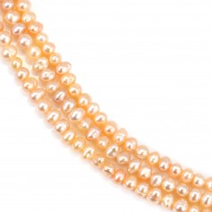Salmon color oval freshwater cultured pearls on thread 4mm x 40cm